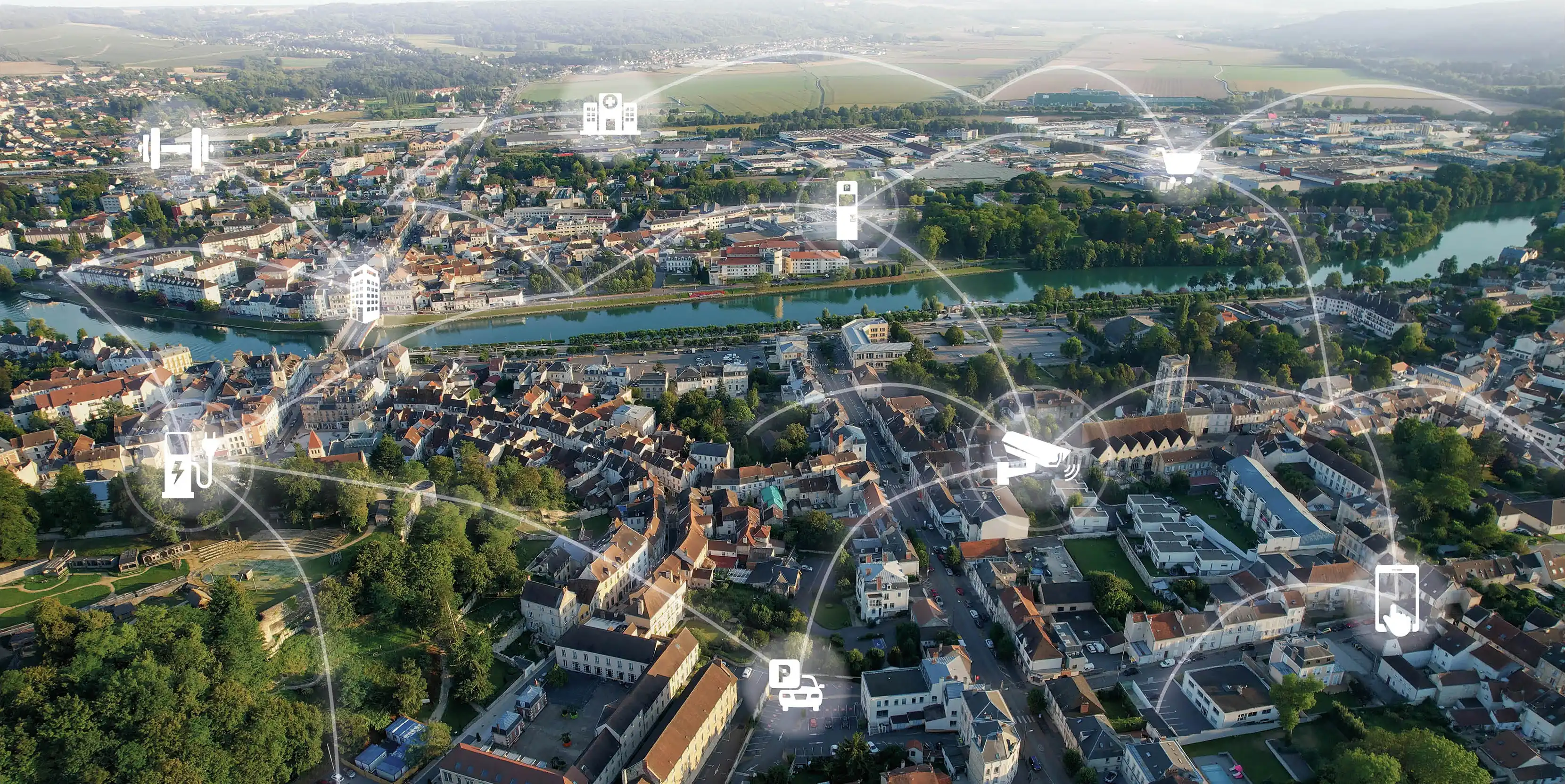 Digitale Vernetzung einer Stadt mit Symbolen für Parken, E-Ladestationen und moderne Parkraumbewirtschaftung